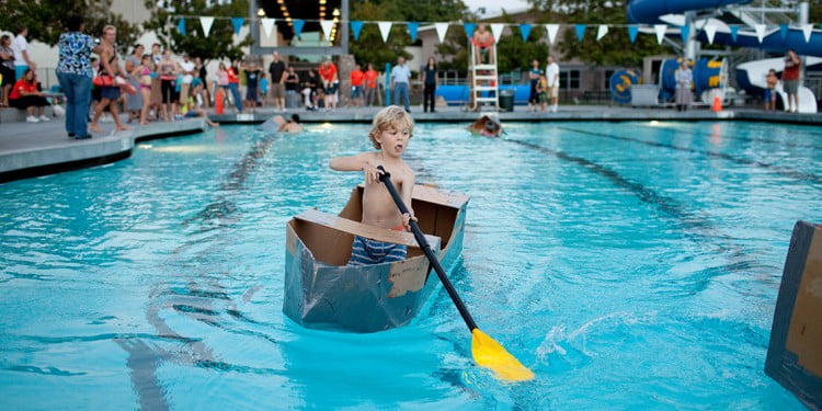 Contestant crossing the pool during the Build Your Own Boat Regatta