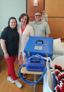 Erica Willenbring, of Little Joys Remembrance Foundation, with Jana and Jeff Hahn, who donated a Cuddle Cot on behalf of their son.